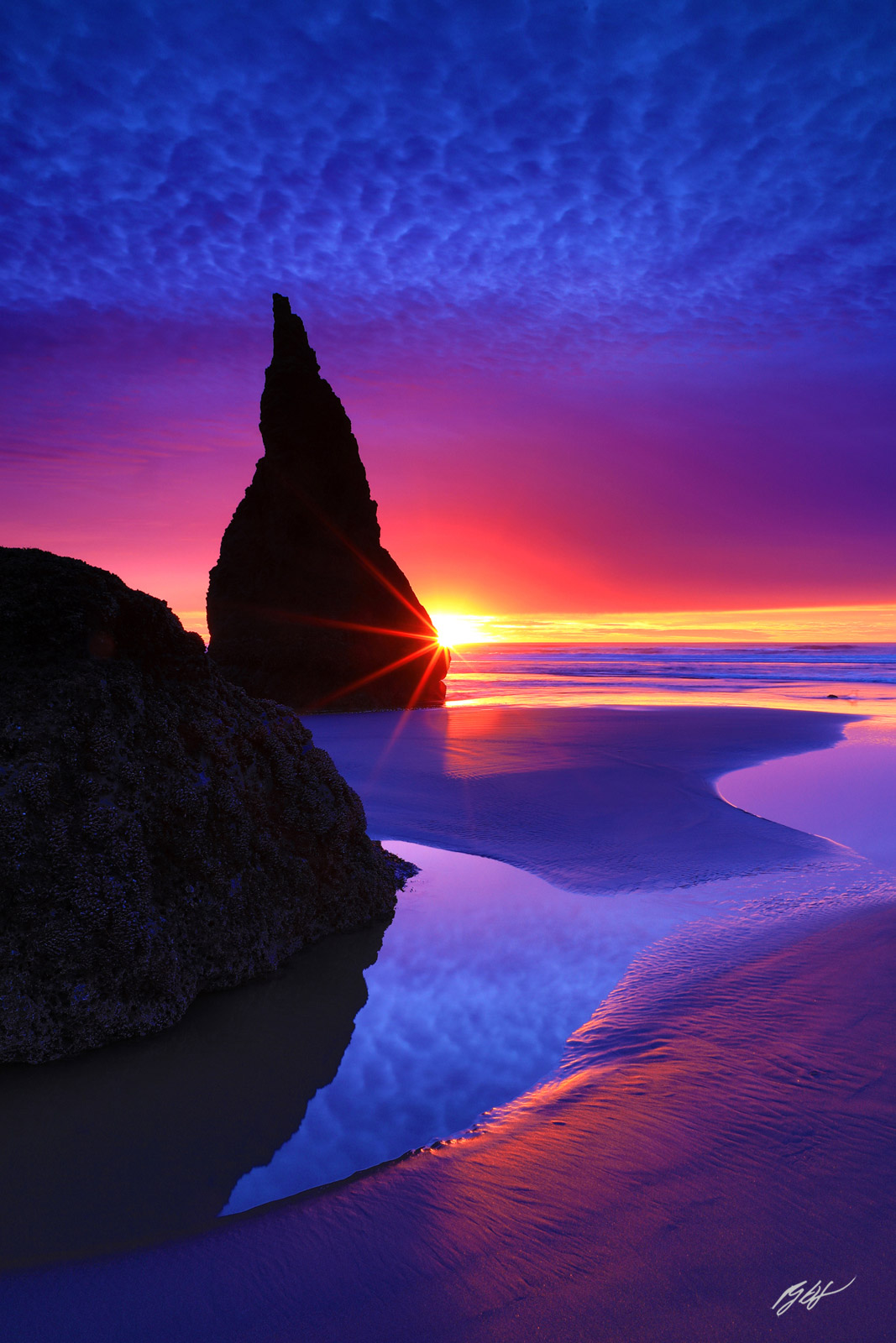 Sunset and Sunstar with the Wizards Hat from Face Rock Beach in Bandon Oregon