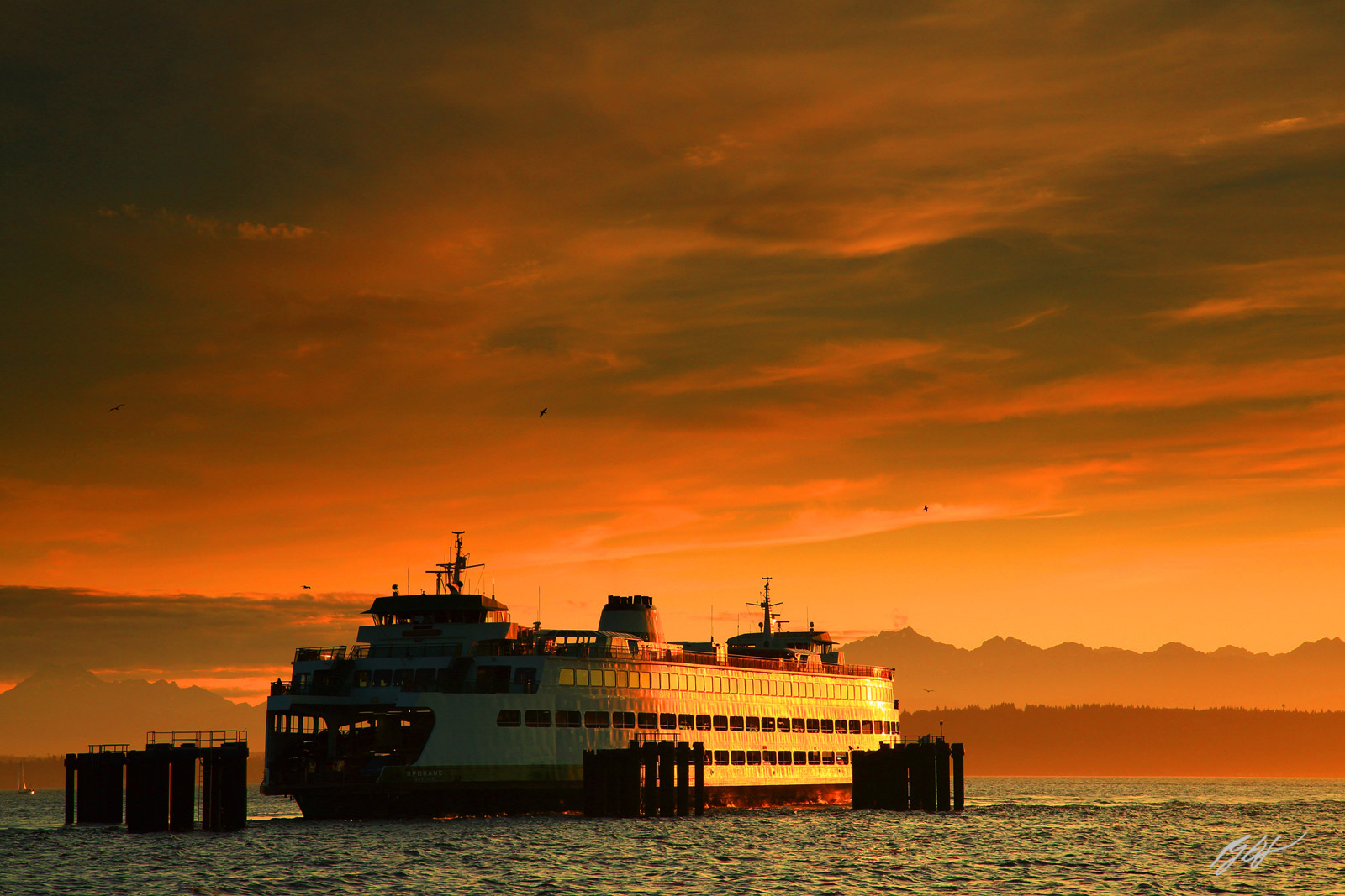 Golden Sunset Edmonds Ferry Approaching Dock from Edmonds Beach in Washington