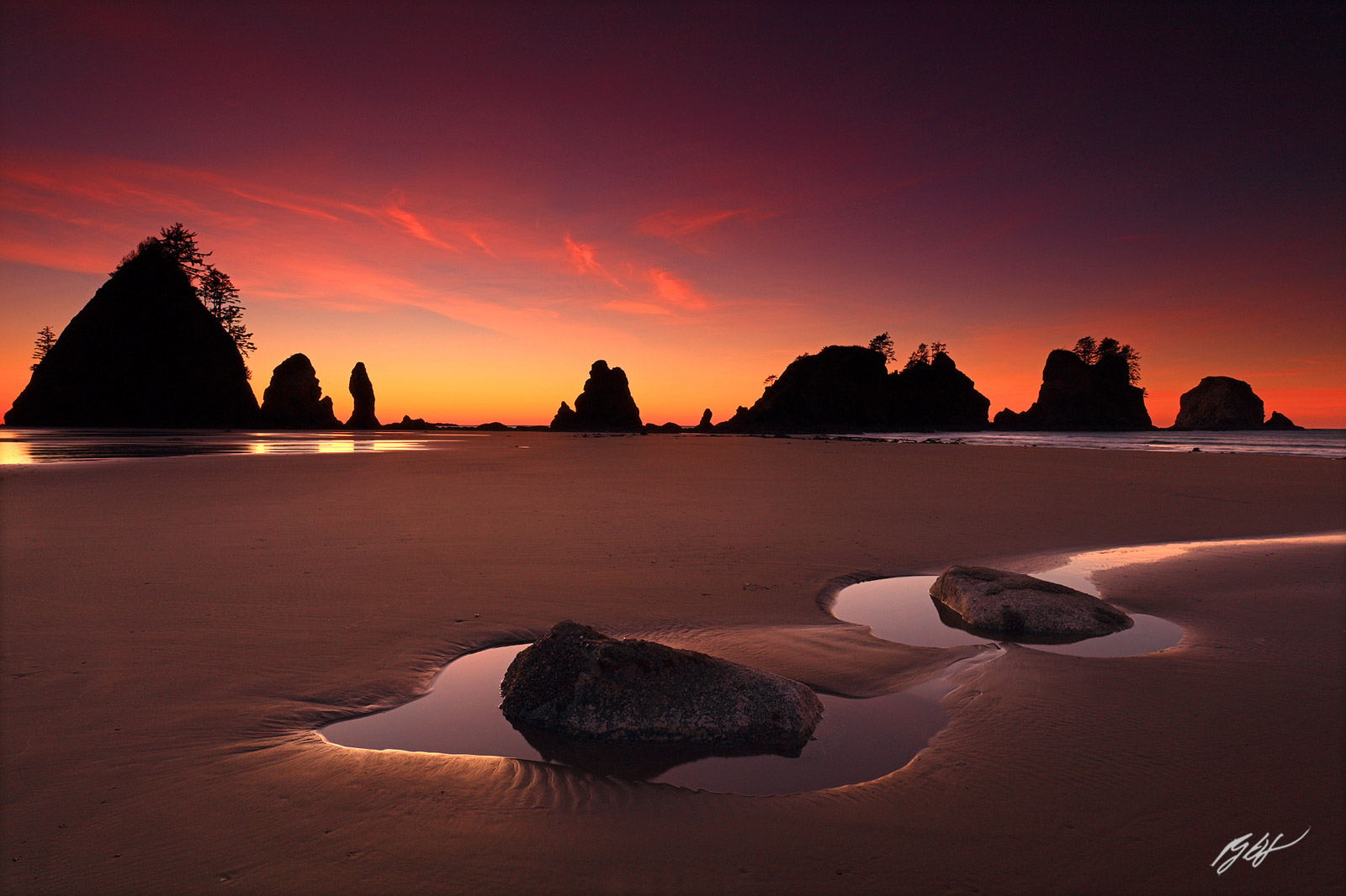 Sunset with the Point of the Arches on Shi Shi Beach in Olympic National Park in Washington