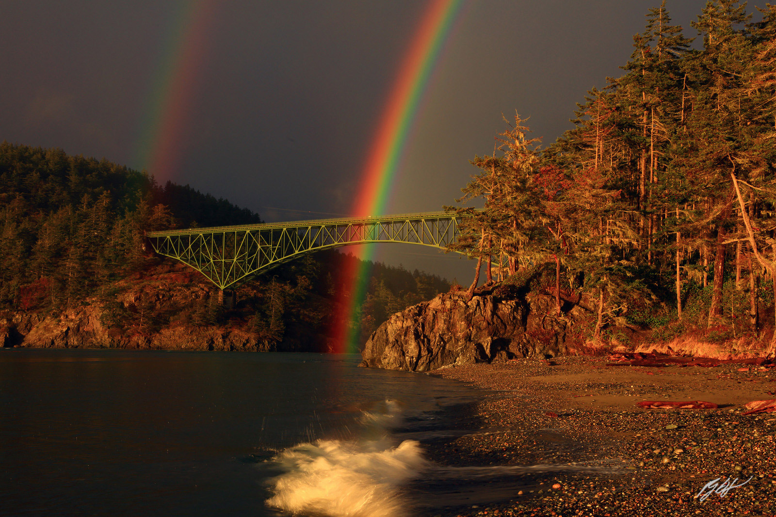 Double Rainbow Drop in the Deception Pass Bridge During a Rainstorm from Deception Pass State Park in Washington
