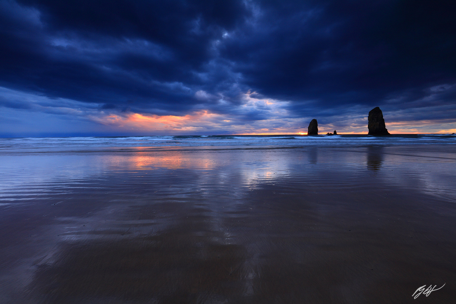 Stormy Sunset with the Needles Rock Formations from Cannon Beach in Oregon