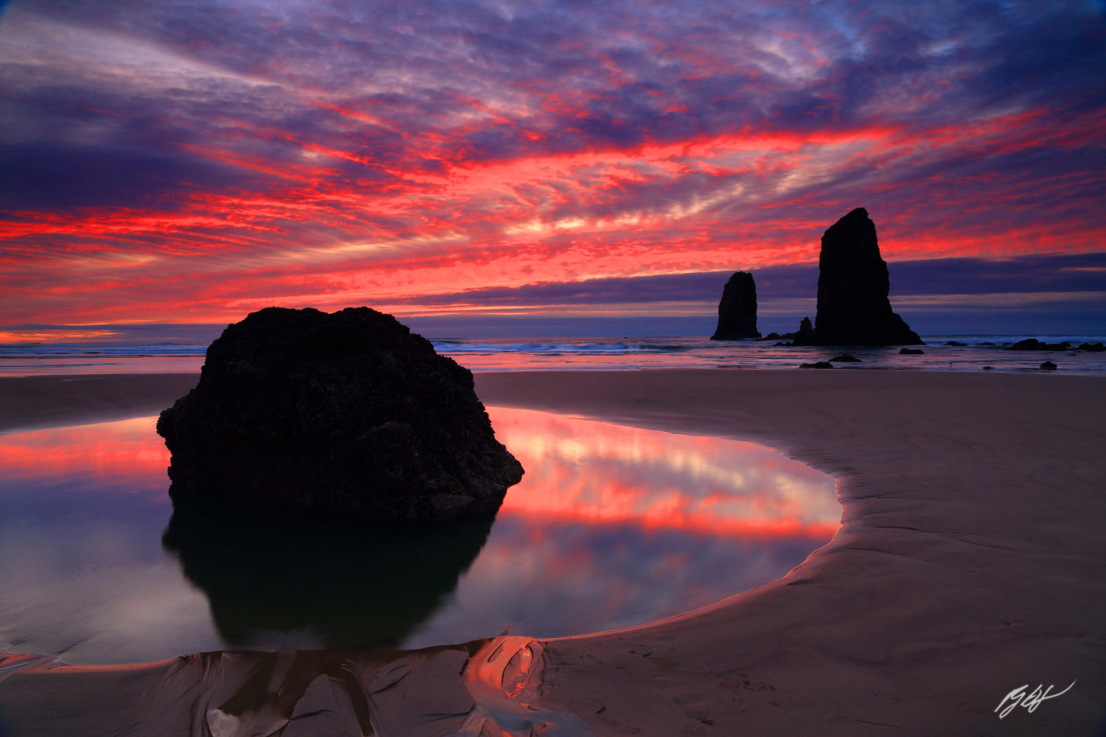 Sunset and the Needles Rock Formations from Cannon Beach in Oregon