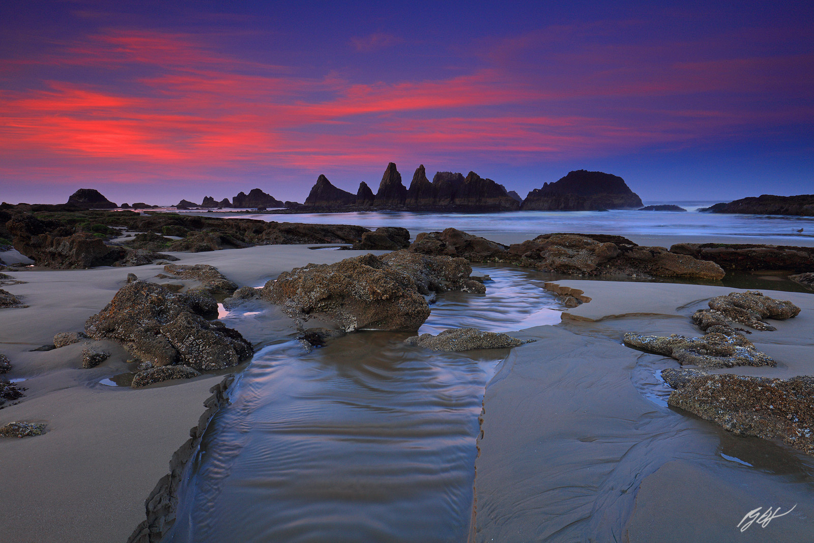 Sunrise and Creek with Rock Formation on Seal Rock State on the Oregon Coast