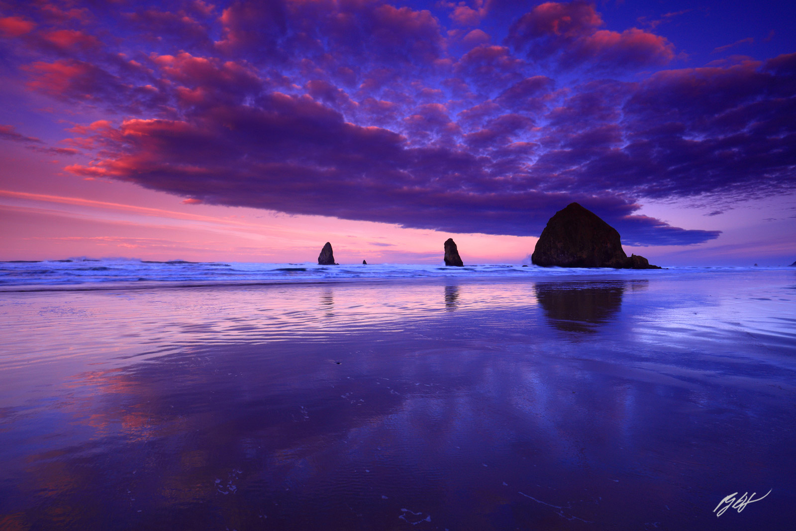 Sunrise and Cool Clouds Haystack Rock and the Needles from Cannon Beach Oregon