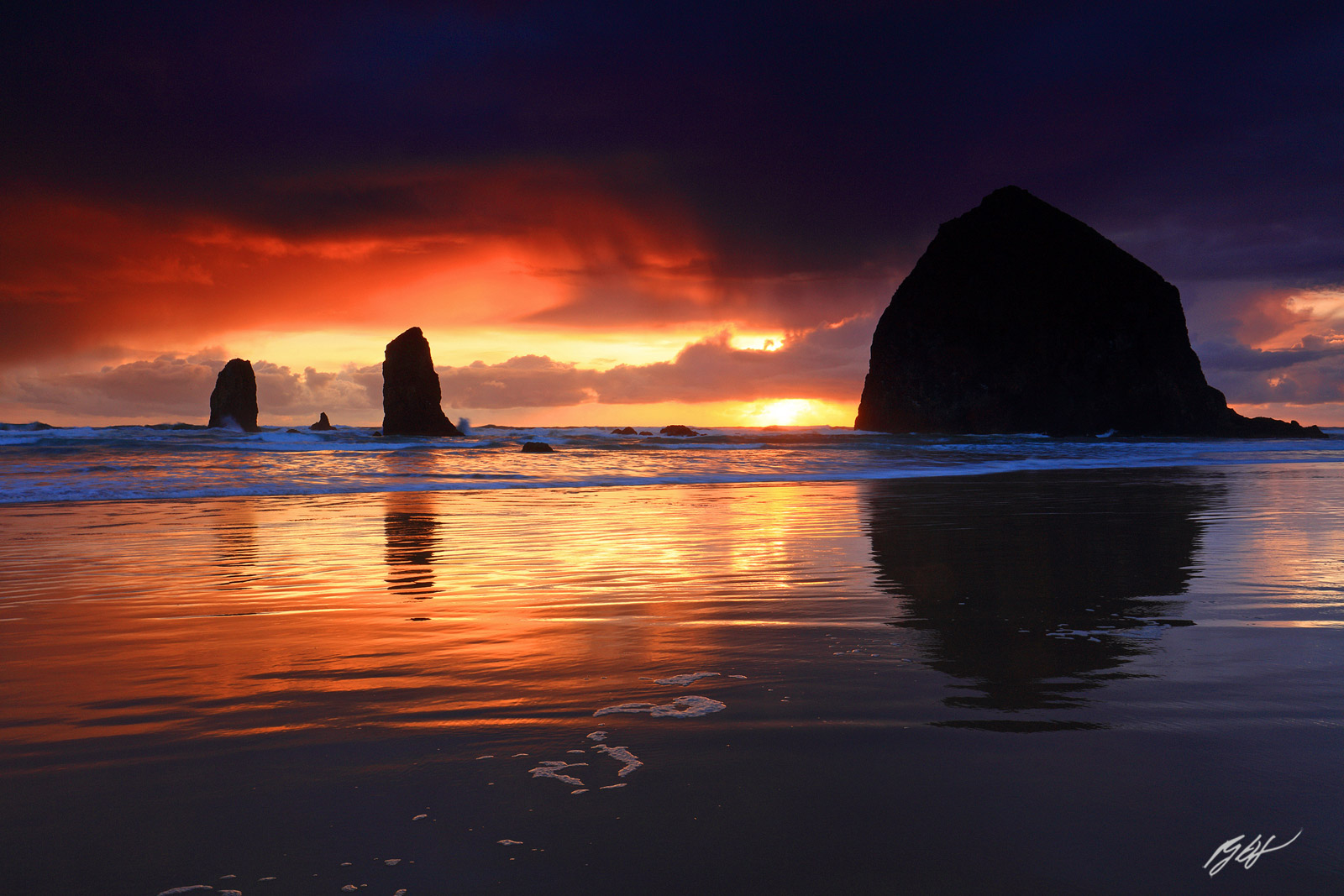 Sunset with Haystack Rock and the Needles from Cannon Beach in Oregon