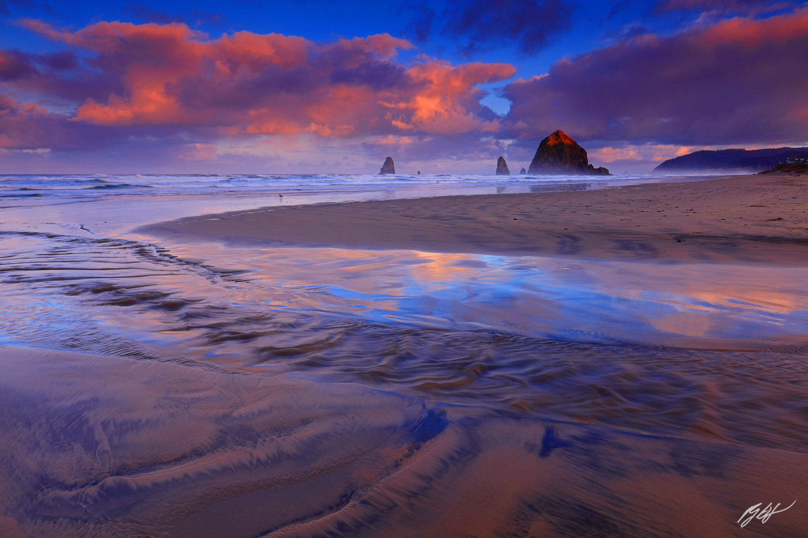 Sunrise and Creek with Haystack Rock and the Needles from Cannon beach in Oregon