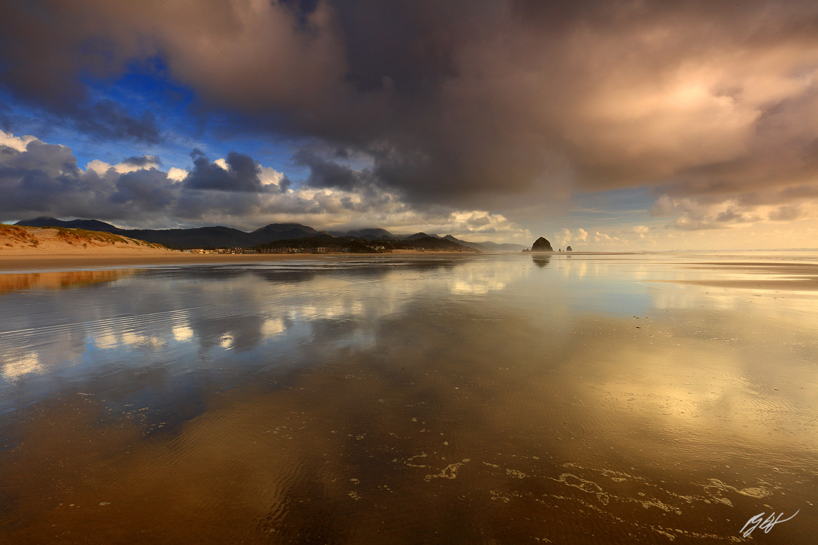 Sunrise Reflections on Chapman Beach in Cannon beach on the Oregon Coast