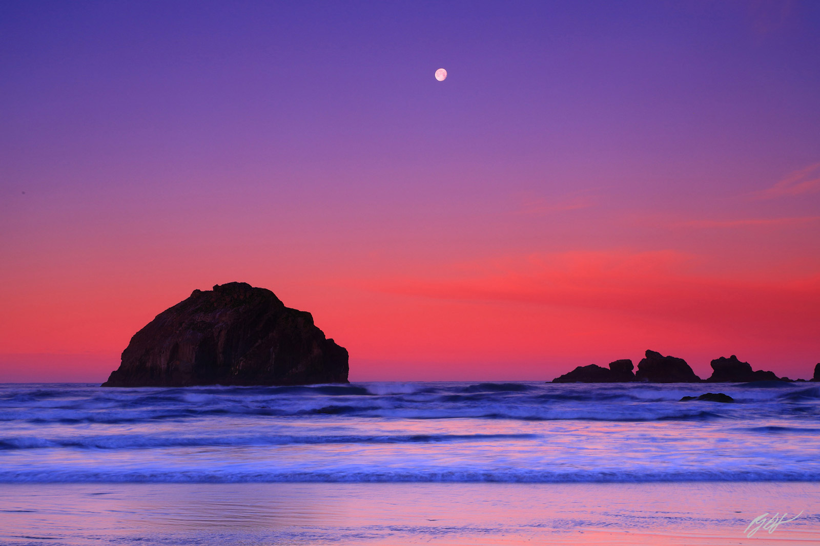 Sunrise Face Rock and the Moon from Face Rock Beach in Bandon Oregon
