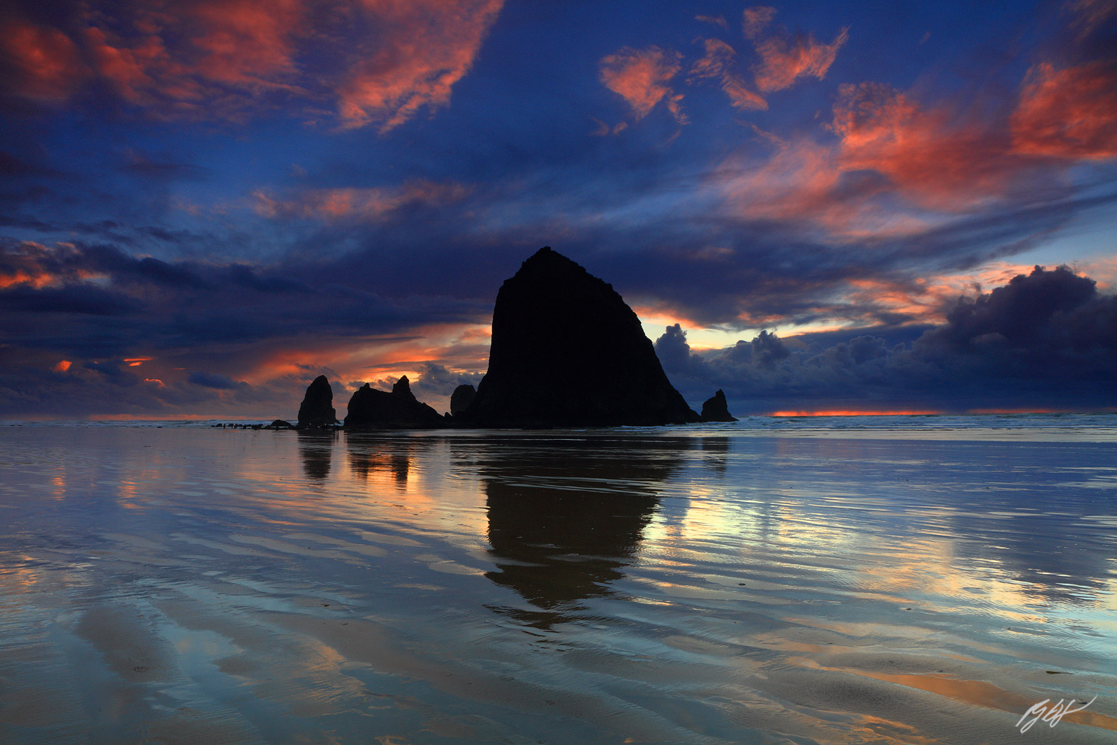 Sunset Reflections with Haystack Rock and the Needles for Cannon beach on the Oregon Coast