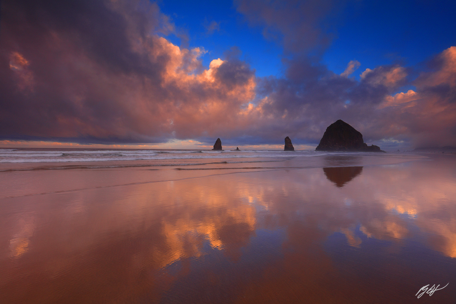 Cool Cloud Reflections and Haystack Rock and the Needles from Chapman Beach in Cannon Beach, Oregon