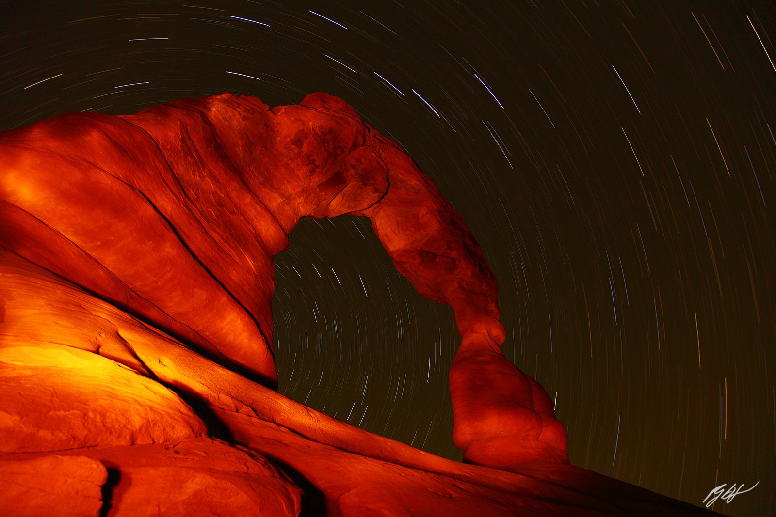 Star Trails and Light Painting on the Delicate Arch in Arches National Park in Utah