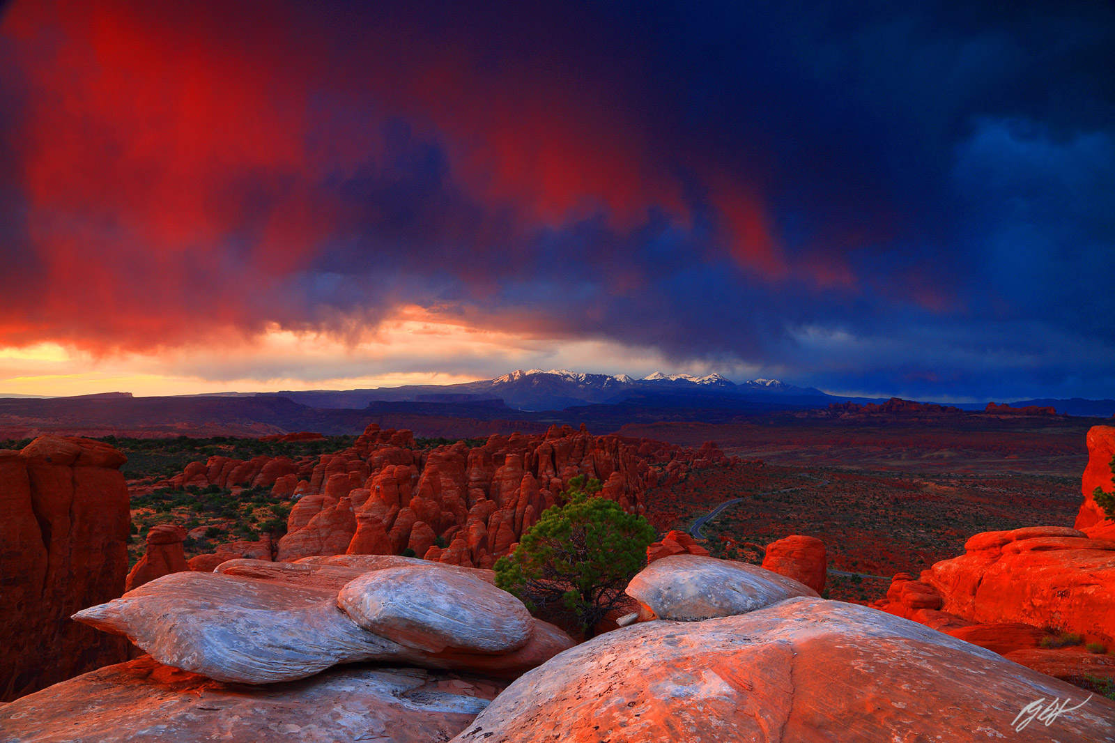 Sunrise on Storm Clouds over the Fins in arches National Park in Utah