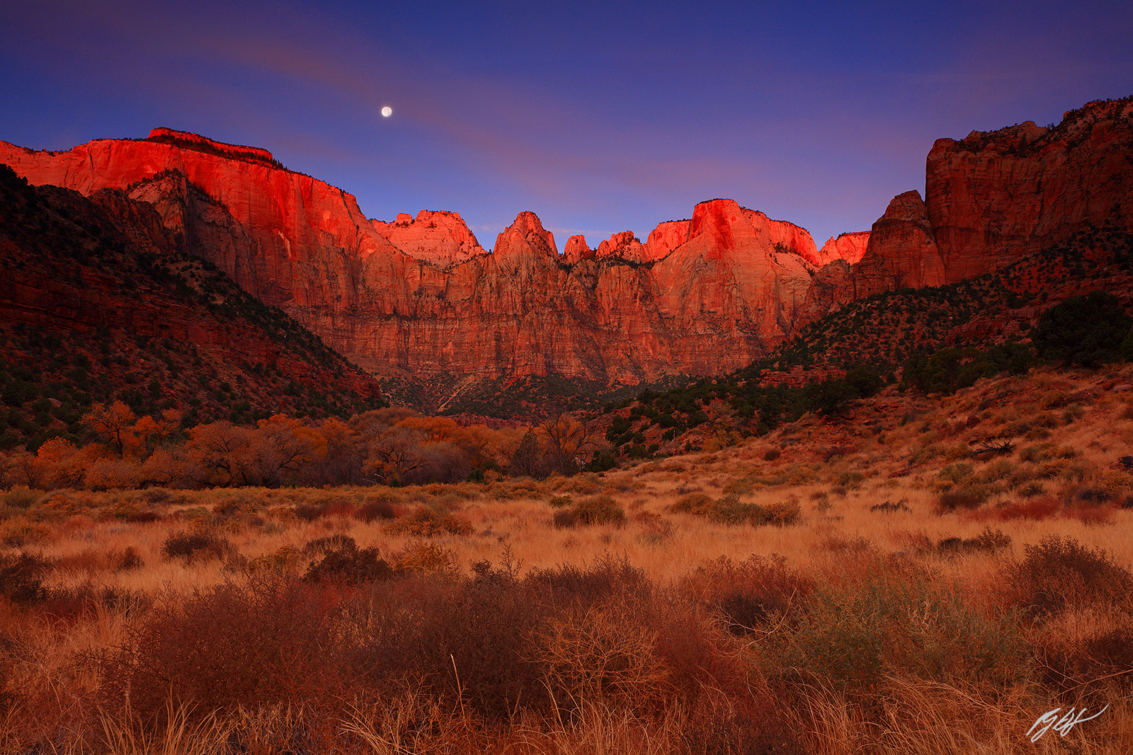 Sunrise on the Towers of the Virgin with the Moon in Zion National Park in Utah
