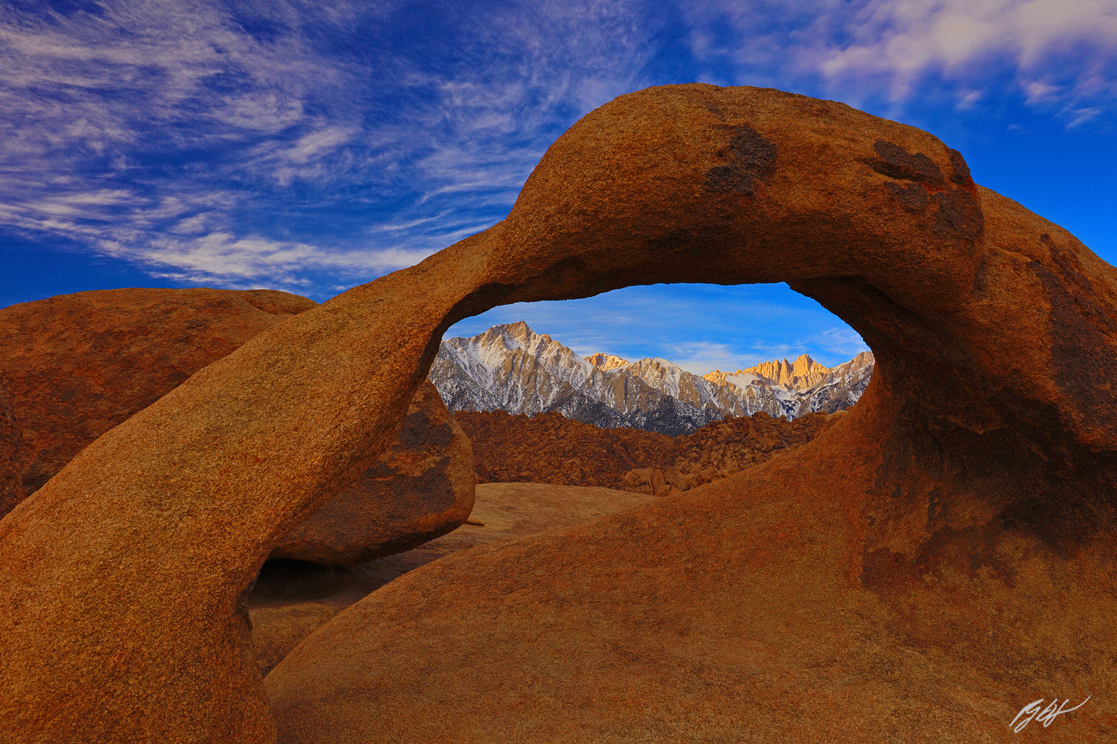 Morning Light on Lone Pine Peak and Mt Whitney through the Mobius Arch in the Alabama Hills Recreation Area in California