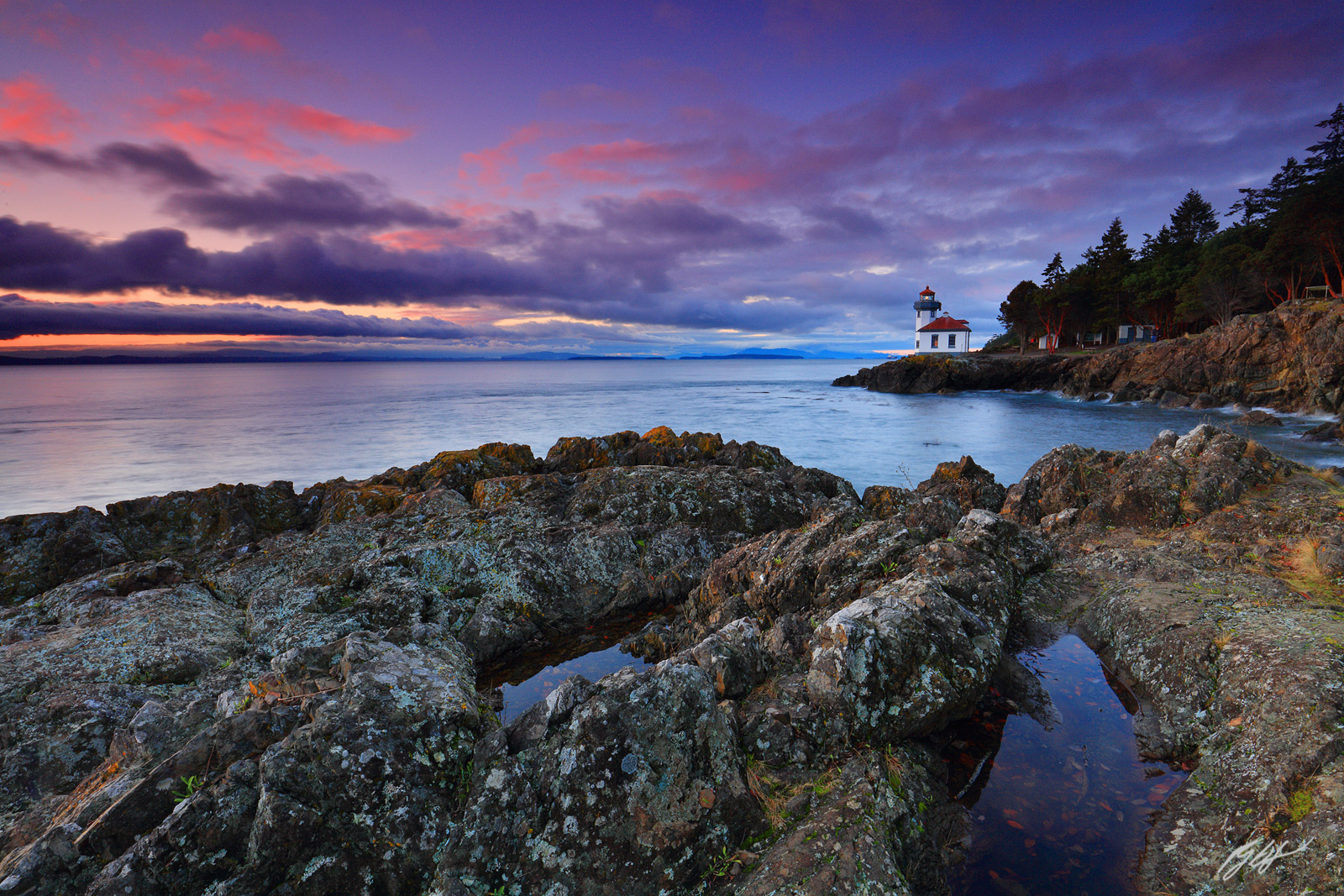 Sunset Lime Kiln Lighthouse in Lime Kiln State Park on San Juan Island in Washington