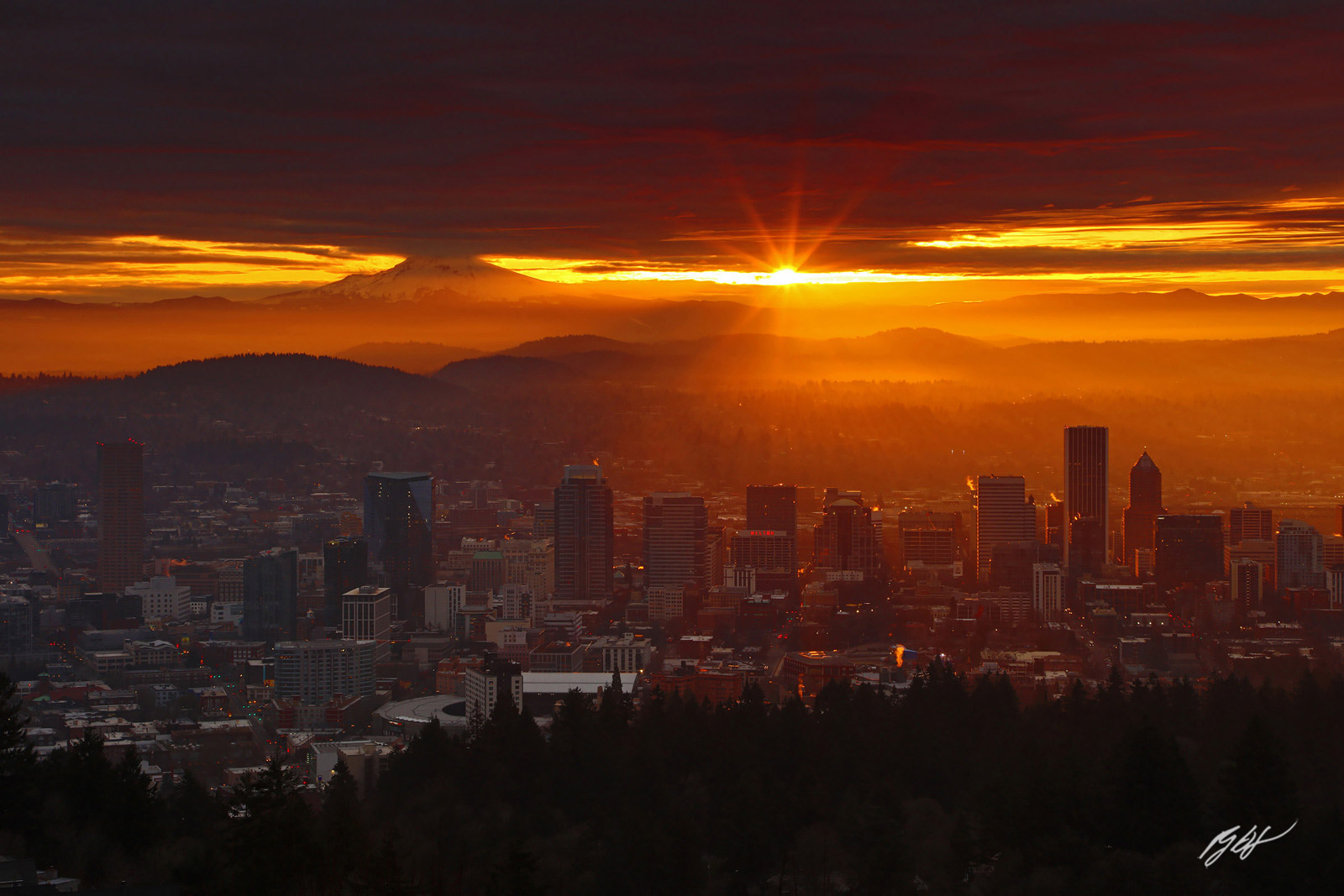 Sunrise and Sunstar over Portland with Mt Hood from the Pittock Mansion in Portland Oregon