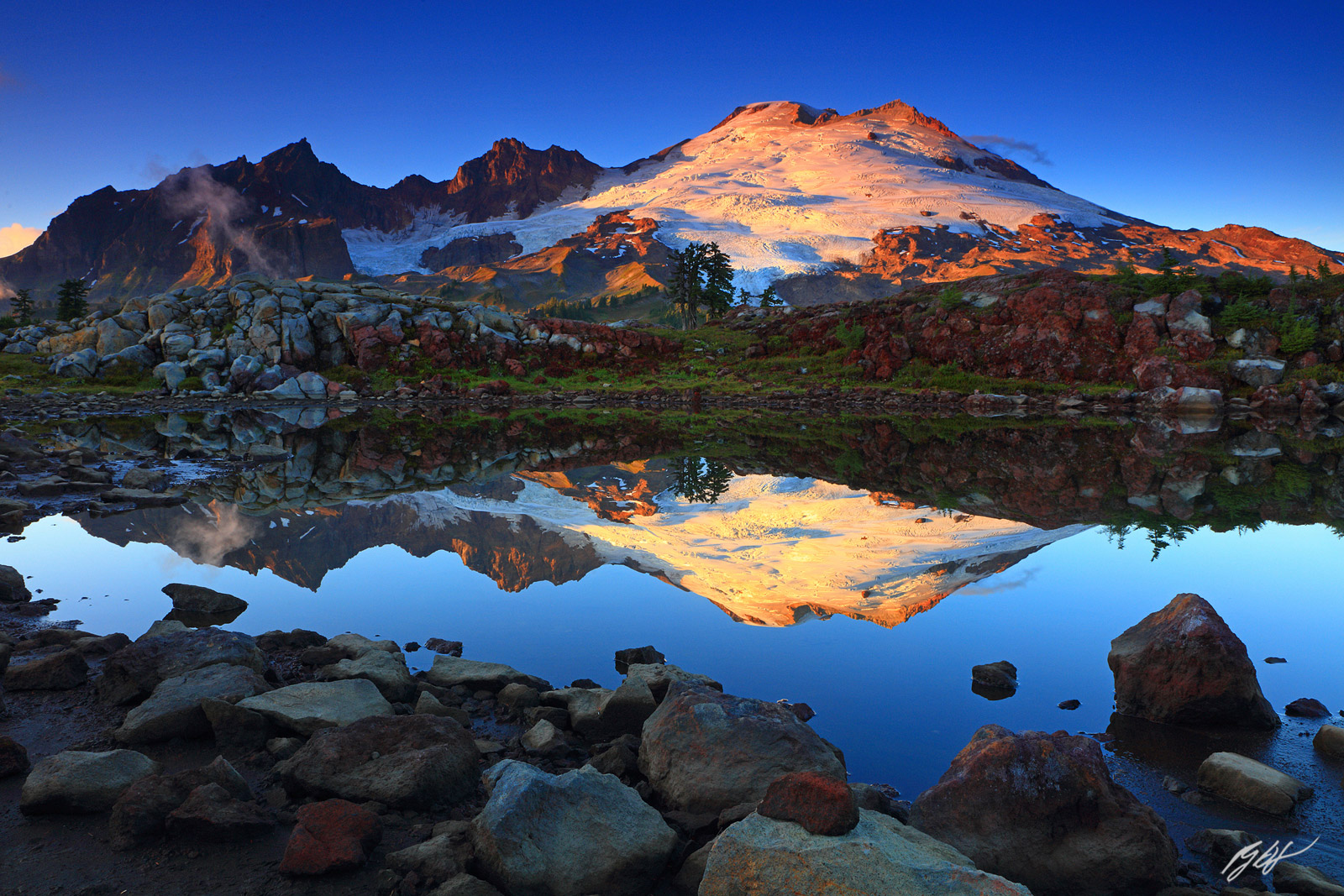 Sunset Mt Baker Reflected in a Tarn from Park Butte in the Mt Baker Wilderness in Washington