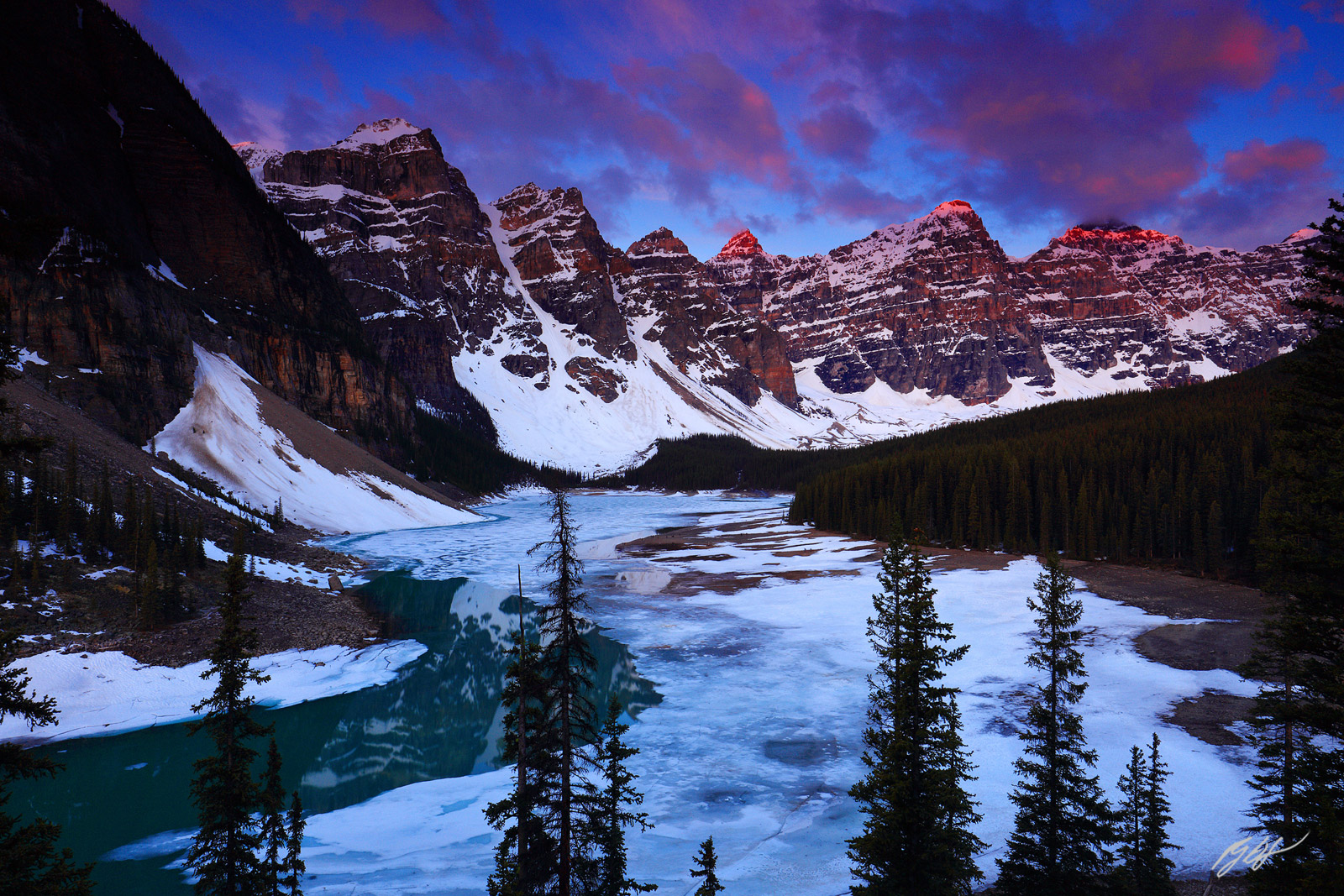 Sunrise and the Ten Peak Over a Frozen Moraine Lake in Banff National Park in Canada