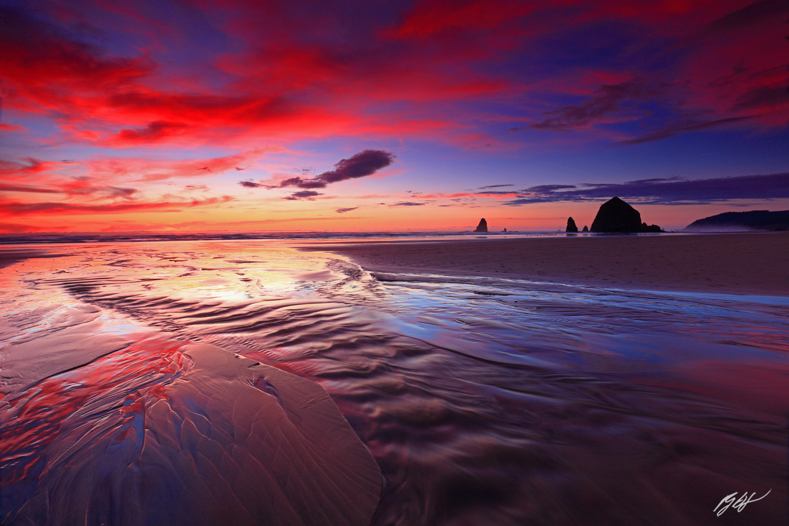 Sunset Haystack Rock and the Needles from Cannon Beach in Oregon
